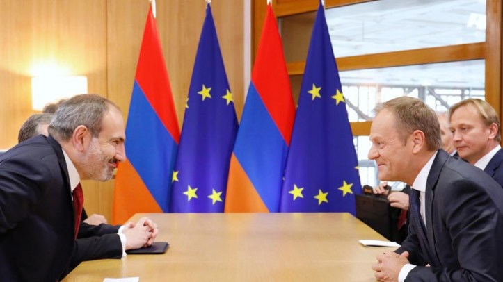 Mr. Pashinyan's eyes light up as he is told of his new salary from Brussels.
